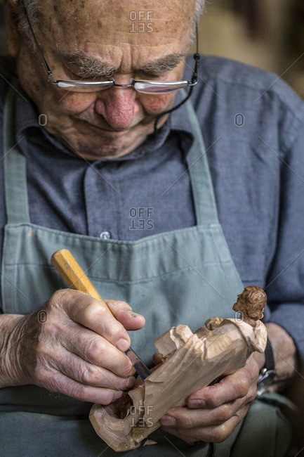 Trentino Alto Adige, Italy - July 9, 2016: Carver in Sesto, Among the centuries-old craft traditions of South Tyrol there to carve real works of art in wood