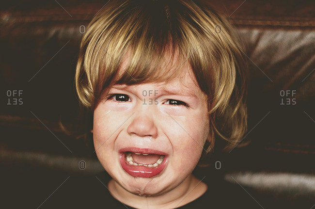 Portrait of a young boy crying