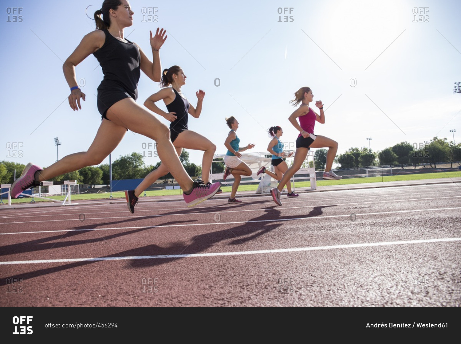 Female runners on tartan track