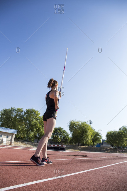 Female pole vaulter preparing - Offset