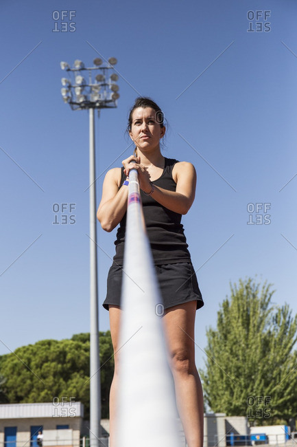 Female pole vaulter preparing - Offset