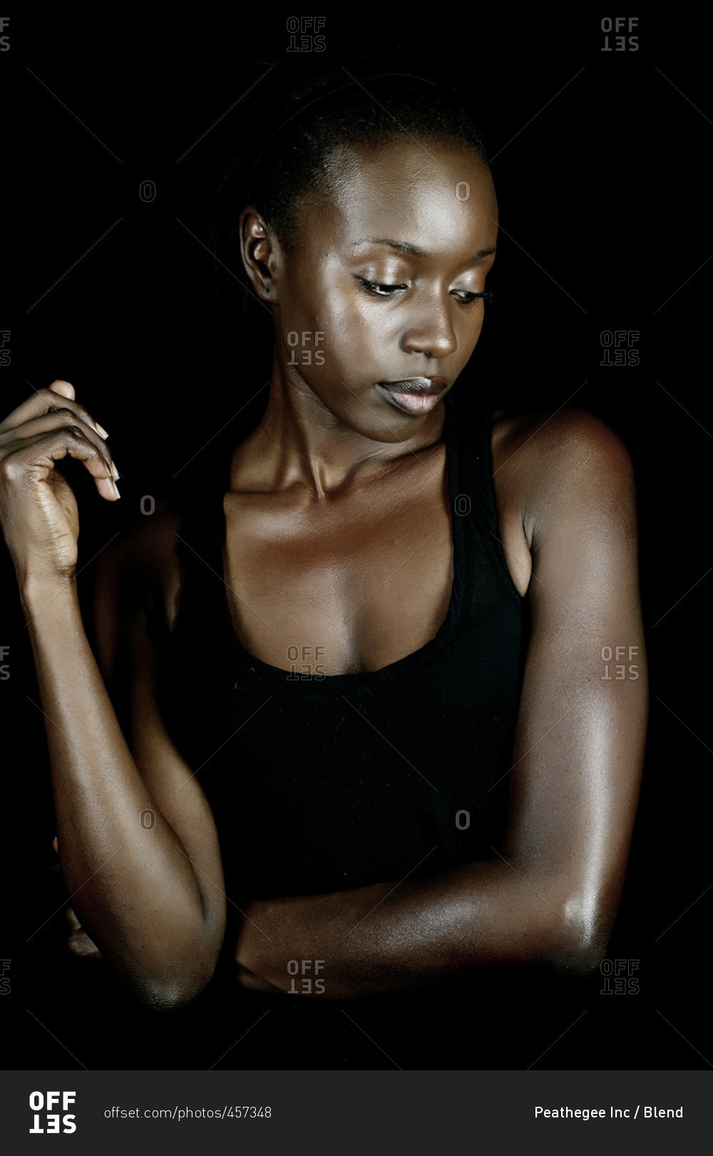 Serious African American Woman Looking Down Stock Photo OFFSET