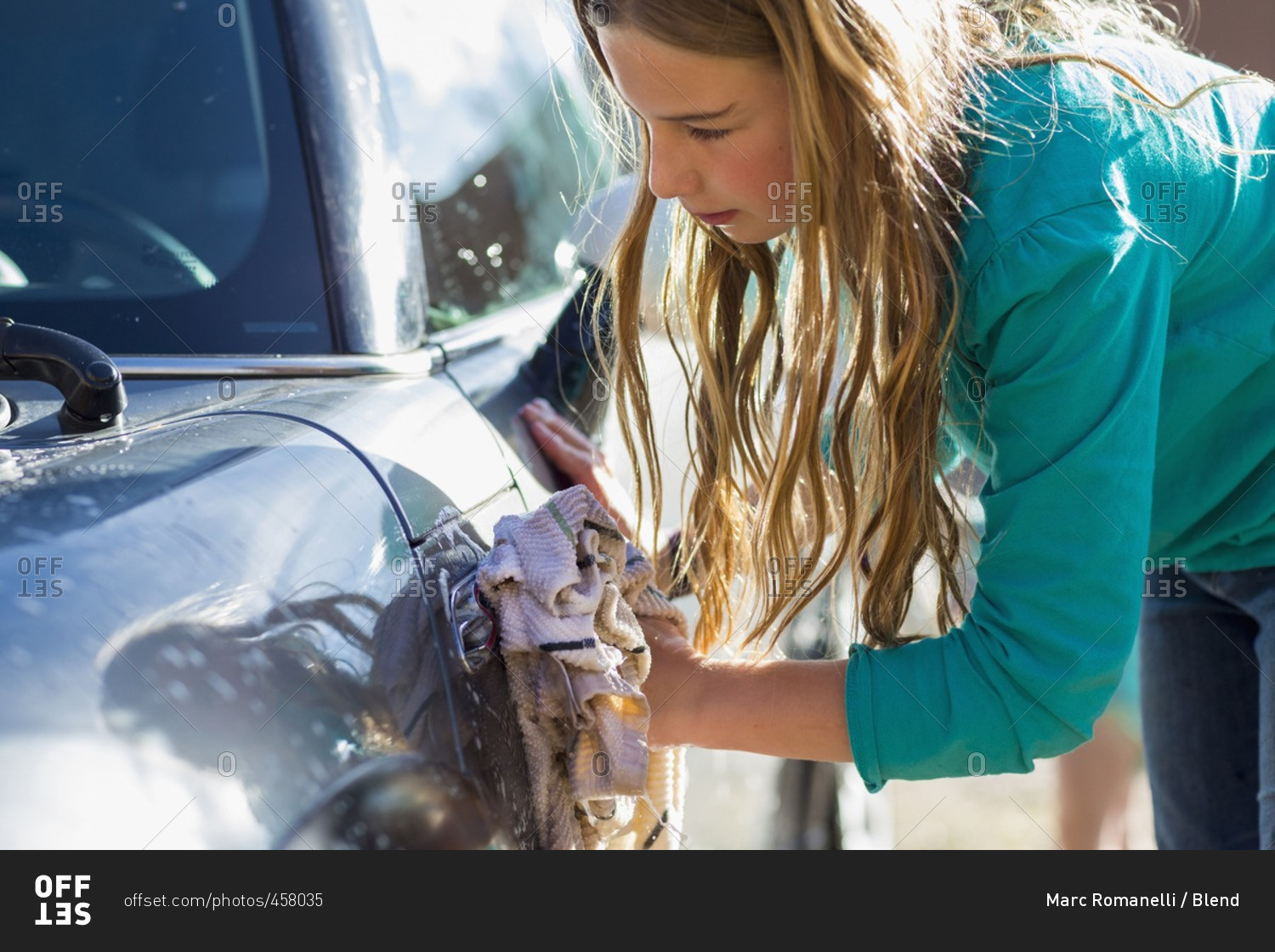 Mary is washing the car