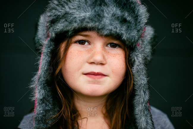 Portrait of a girl in a furry hat