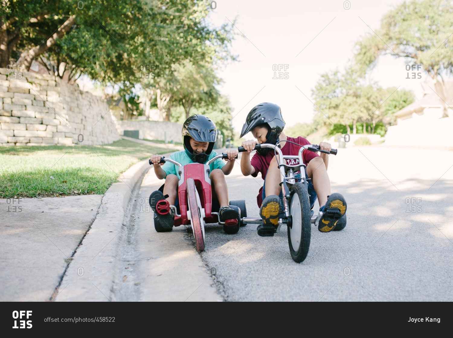 Two brothers riding low rider tricycles
