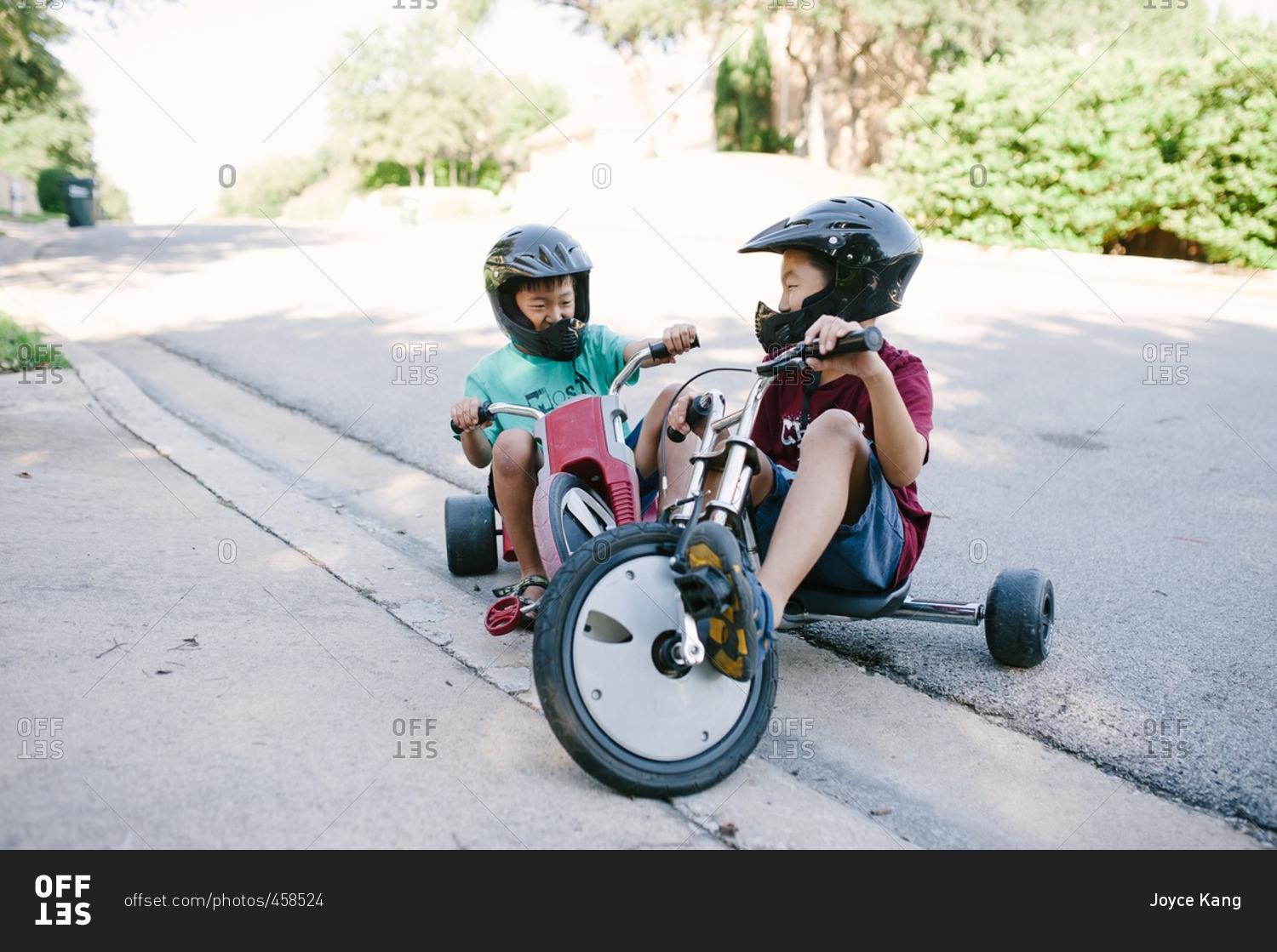Brothers riding low rider tricycles together