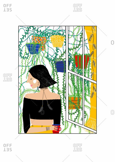 Woman standing in window surrounded by plants