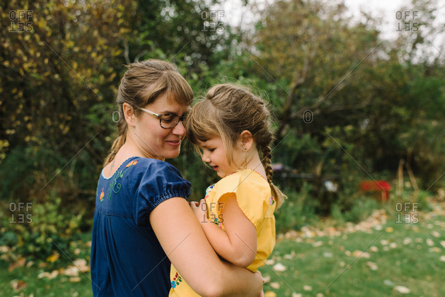 Mom and girl in embroidered shirts