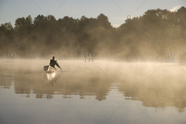 Solo Paddler on the Severn River in Muskoka, Ontario, Canada
