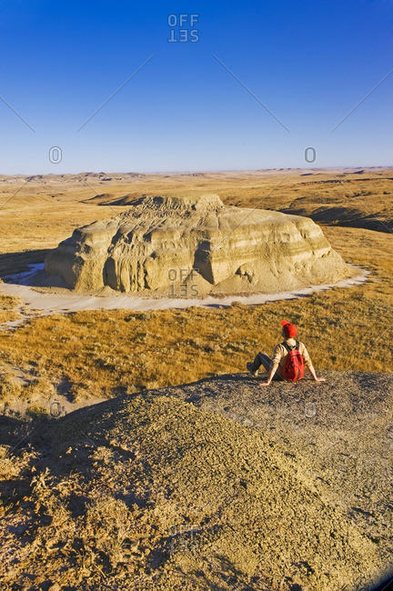 Hiker in the Killdeer Badlands, East Block, Grasslands National Park, Saskatchewan, Canada