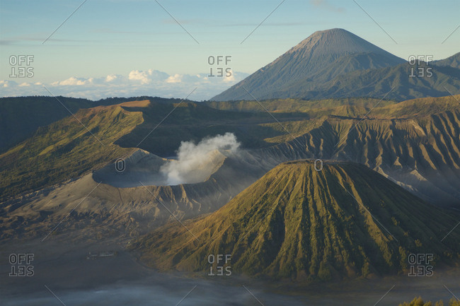 A view of Mount Bromo volcano inside the Tengger Caldera with Mount Semeru in the background.