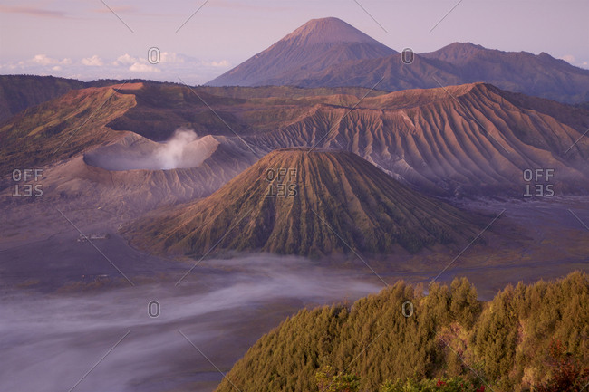 A view of Mount Bromo volcano inside the Tengger Caldera with Mount Semeru in the background.