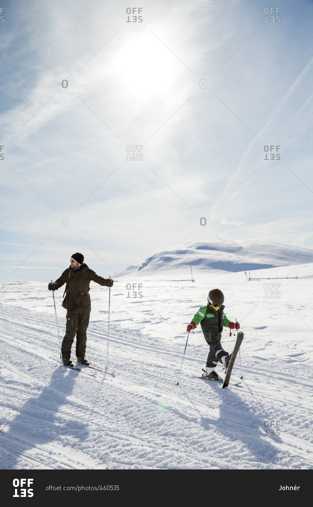 Mother with child skiing