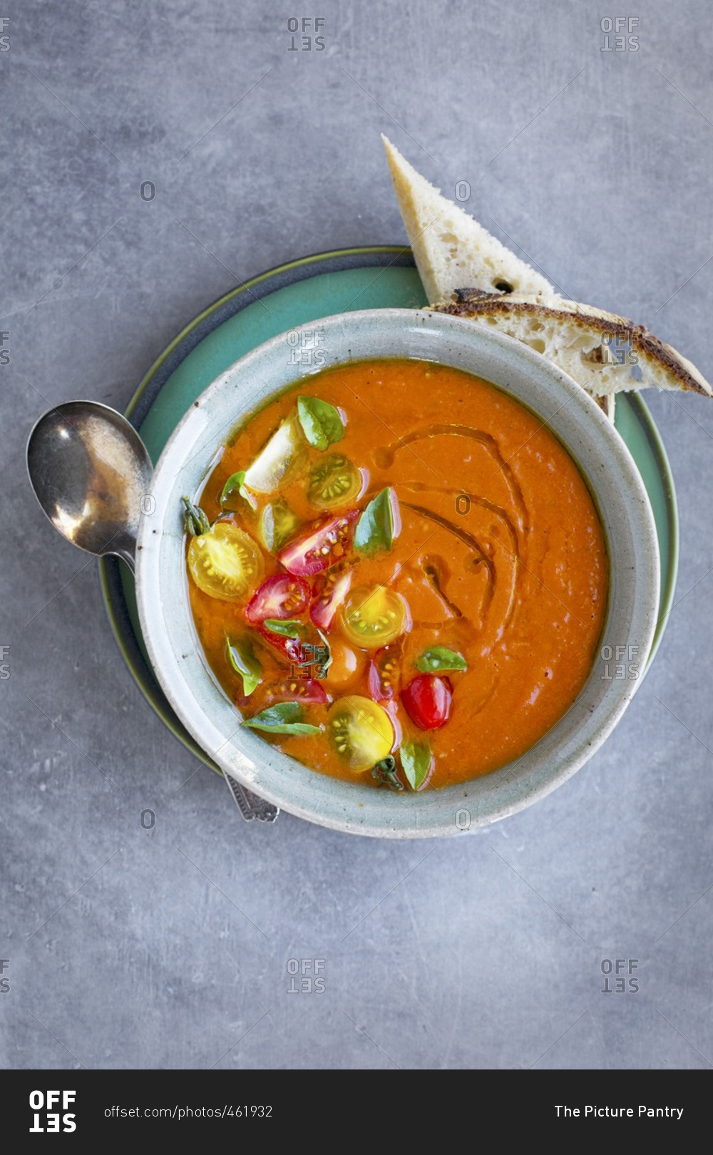 Roasted Tomato Herb Soup topped with cherry tomatoes and basil