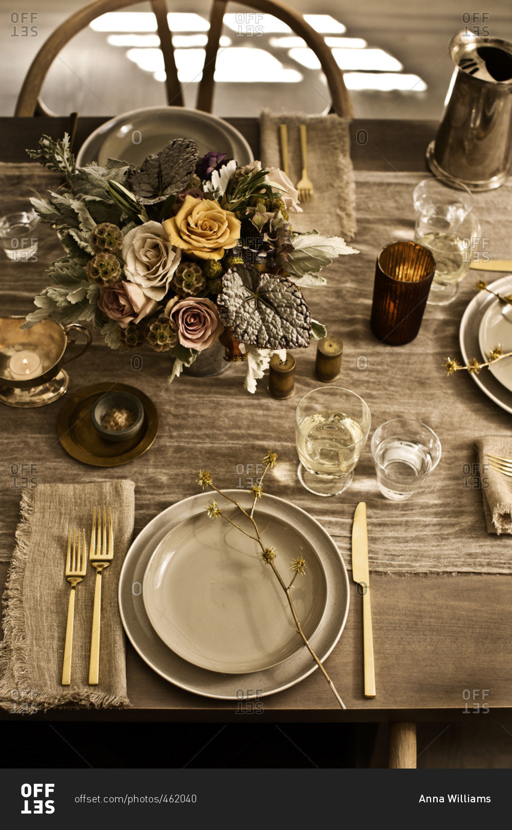 Place settings with floral arrangement and table runner