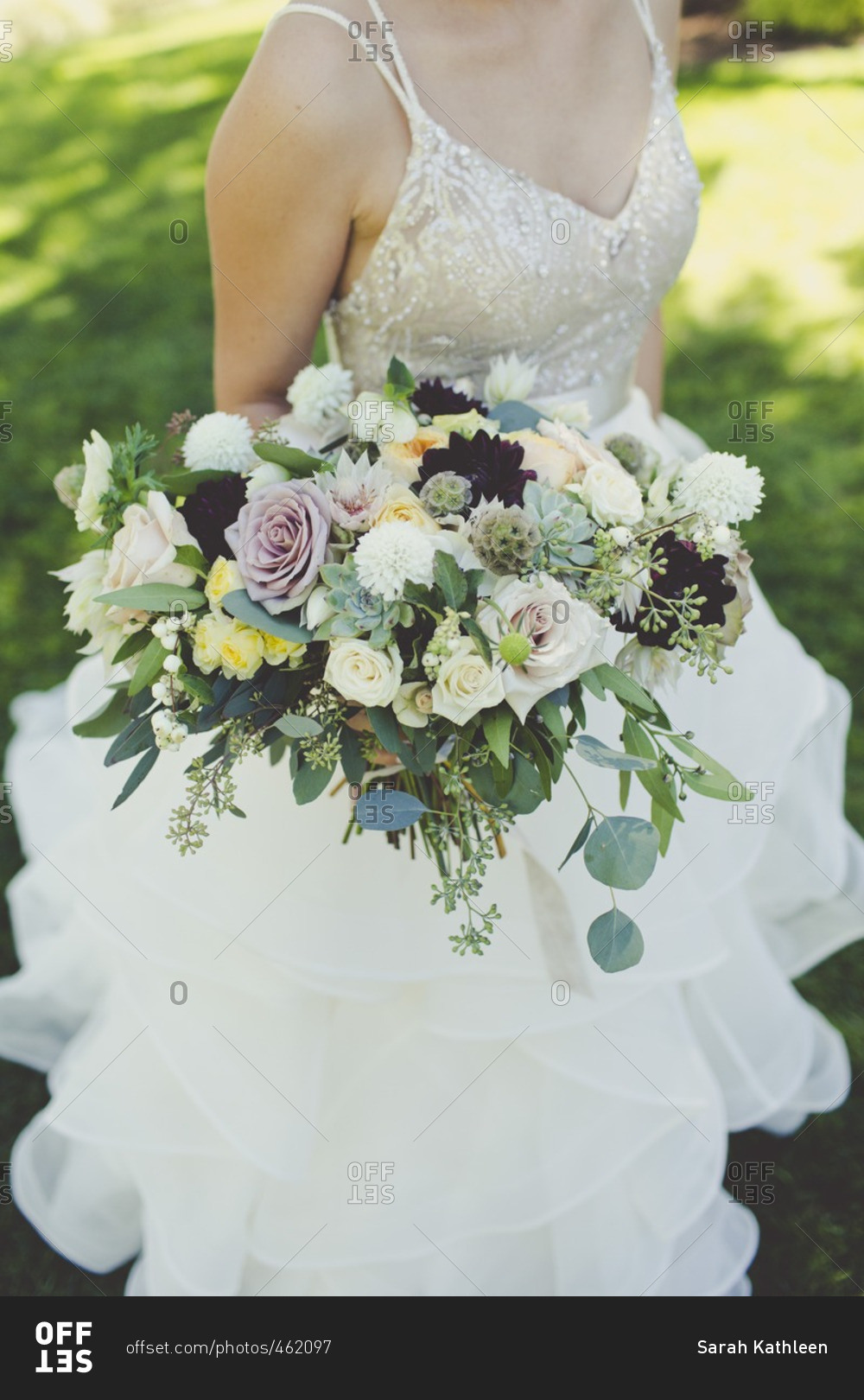 Close-up of a bride holding her wedding bouquet