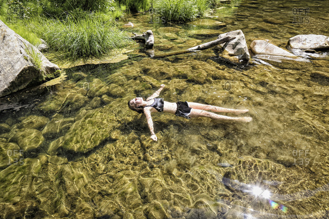 Girl Floats Peacefully In The West Clear Creek, Coconino National Forest, Arizona