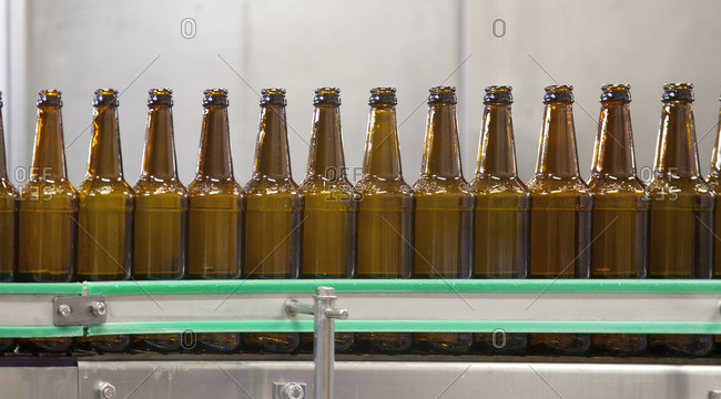 Bottles on production line in bottling plant