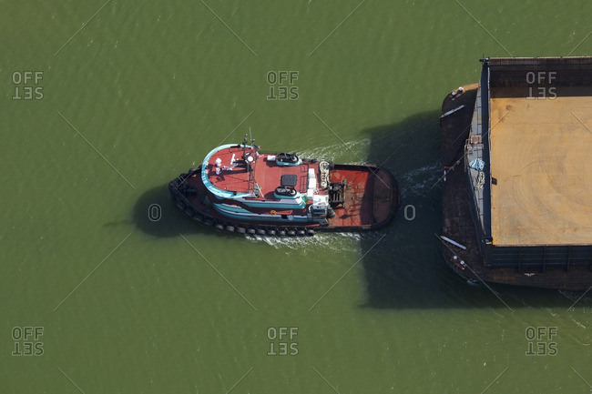 Tugboat pulling barge