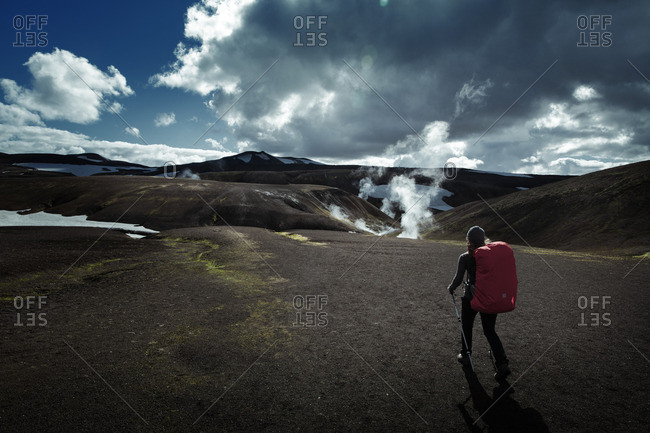 Woman walking on a hiking trail in Iceland
