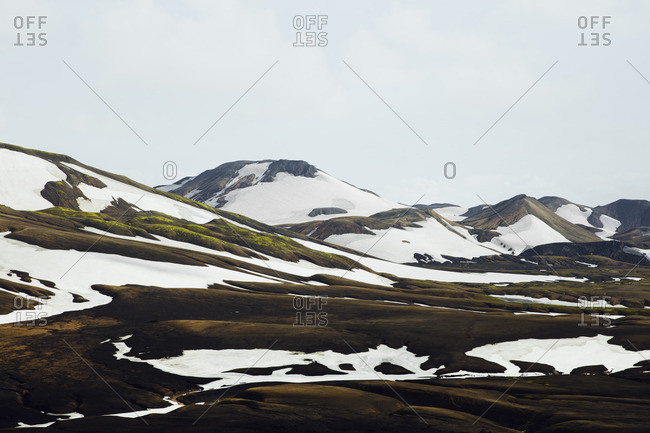 Landscape of snow melting on mountains