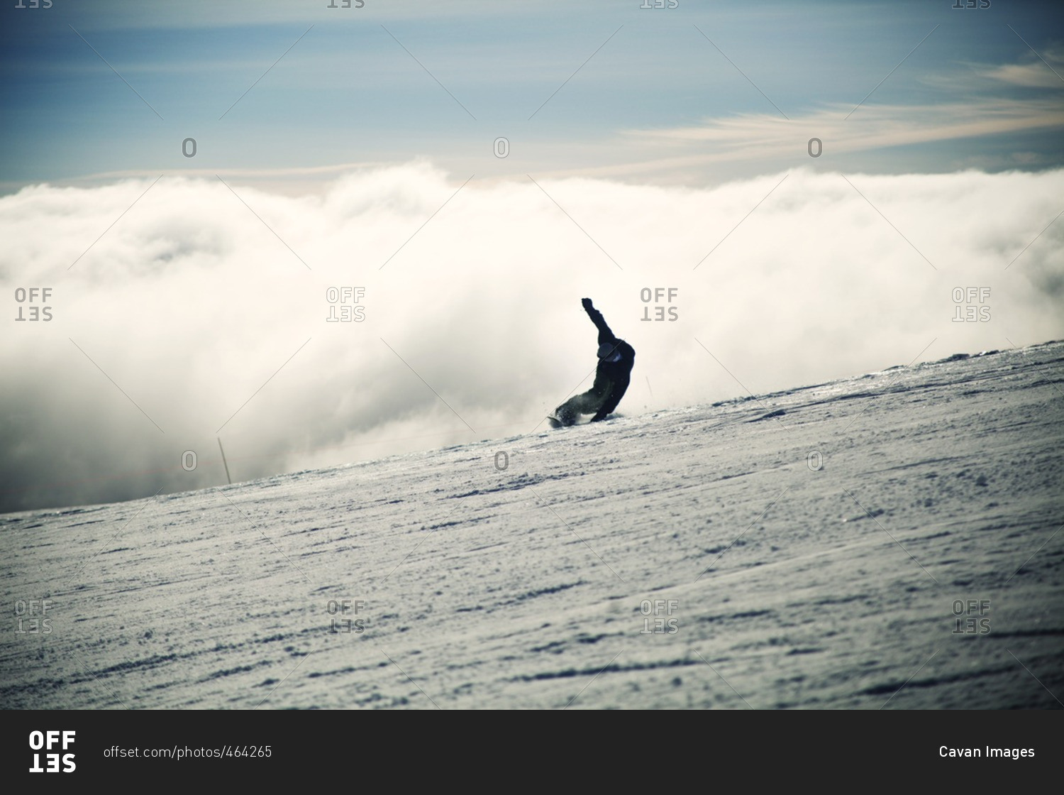 Man snowboarding on snowy landscape during foggy weather
