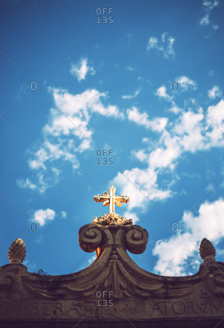 Low angle view of skull and cross sculpture in Syracuse, Sicily, Italy