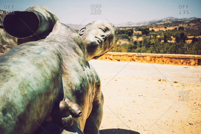 Statue of a nude man at the Valley of the Temples in Agrigento, Sicily, Italy