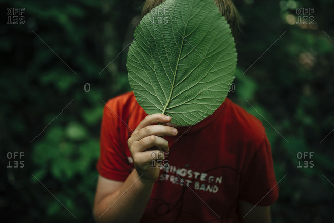 boy hiding his face