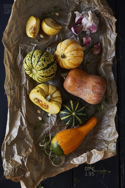 Seasonal squashes on brown paper