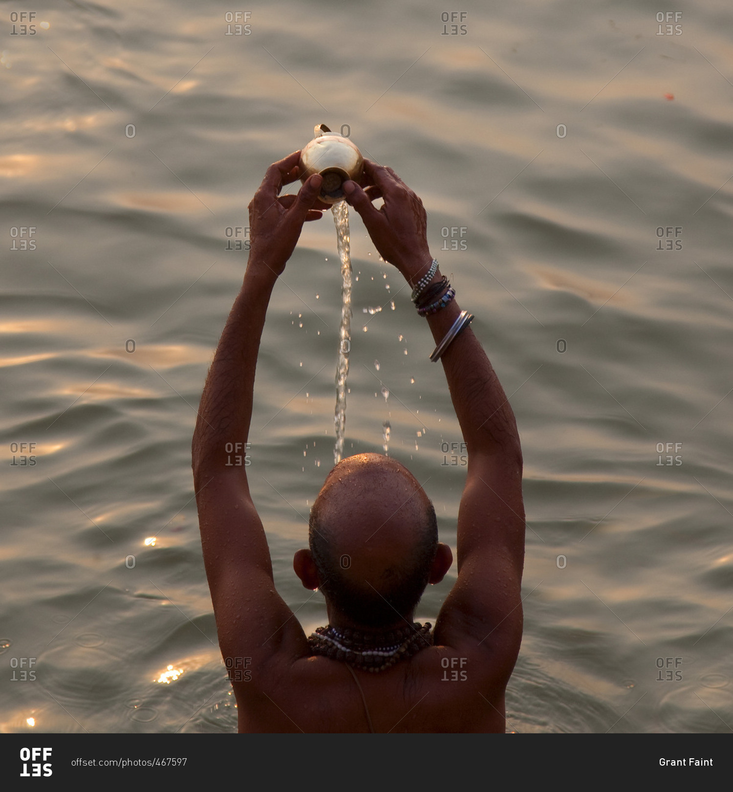 Man pouring water over his head stock photo OFFSET