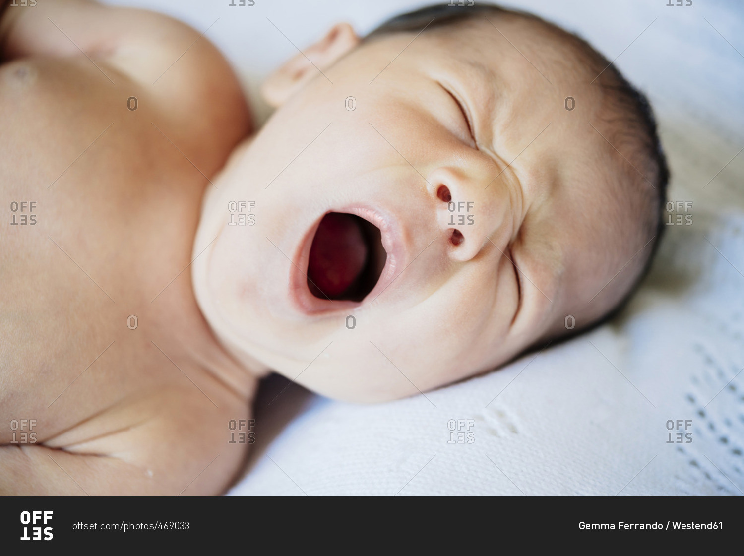 Portrait of yawning baby girl