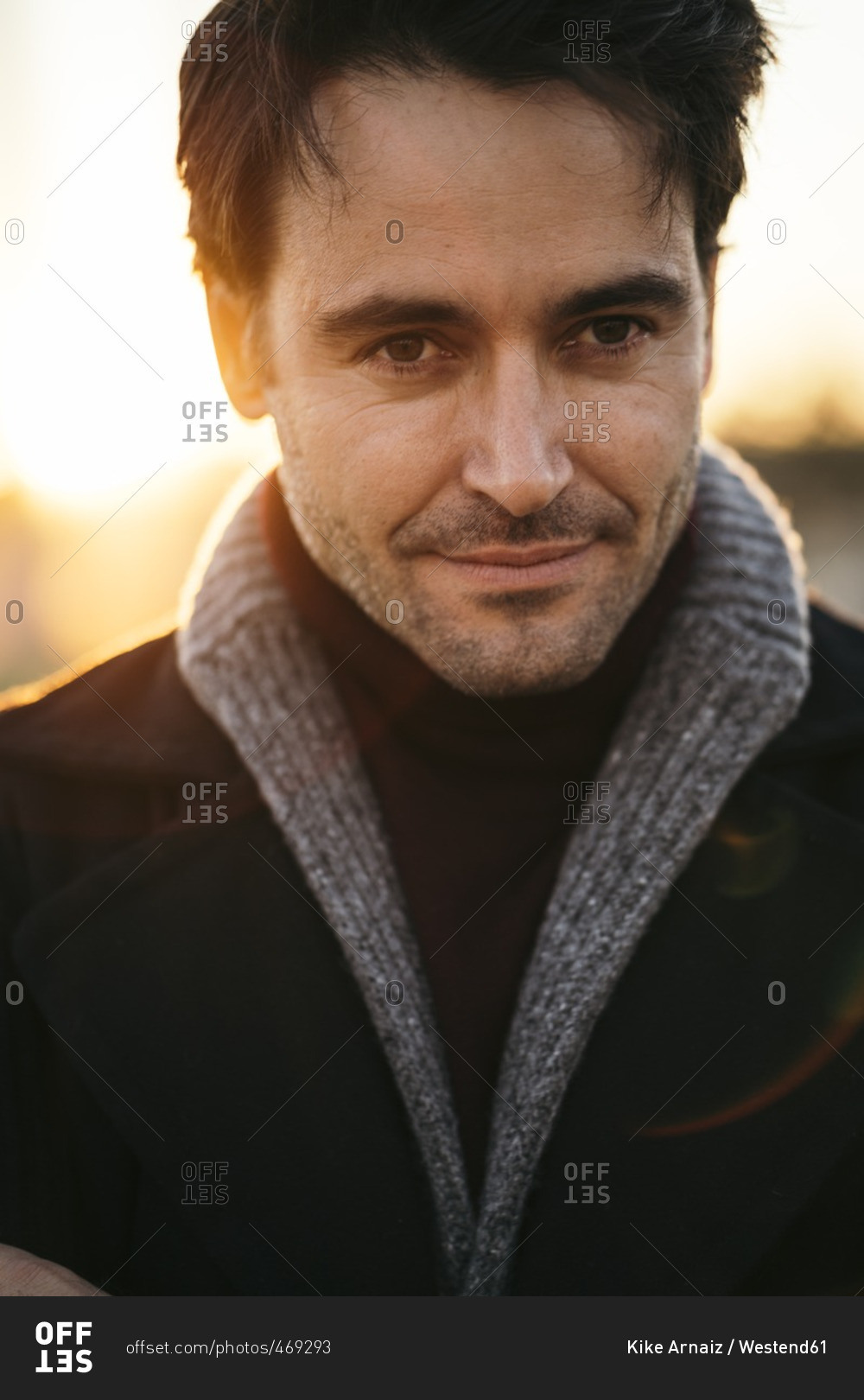 Portrait of man with stubble at sunset