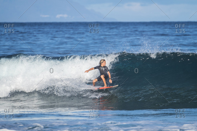 Spain- Tenerife- boy surfing in the sea