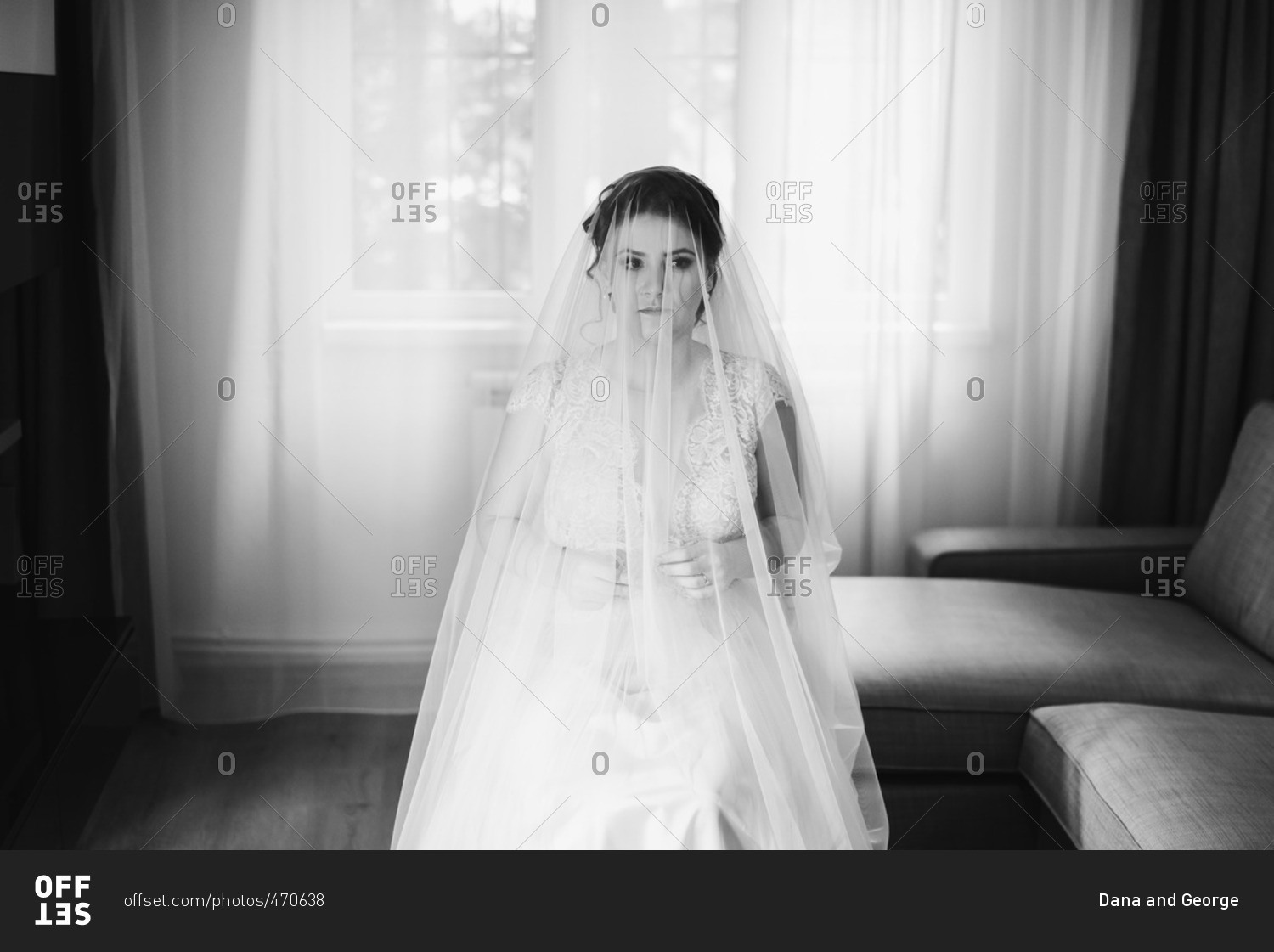 Seated bride with veil over her head