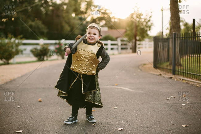 Boy in street in knight costume