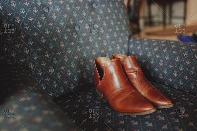 Western Style Booties On Chair Stock Photo Offset