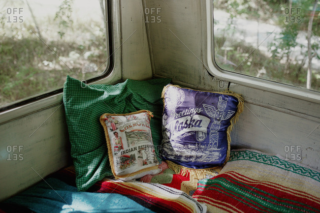 Vintage souvenir pillows in trailer camper