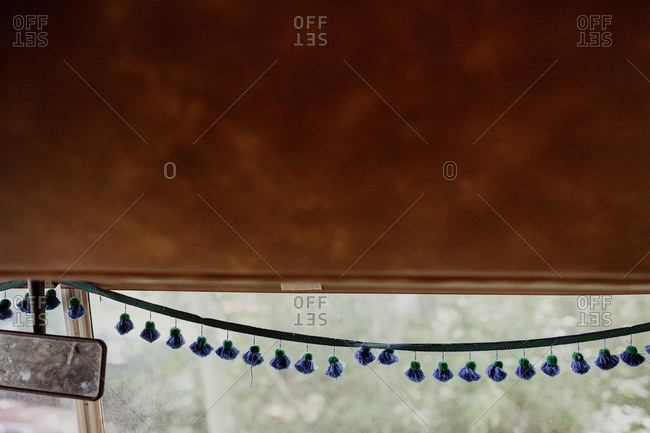 Tassel trim hanging from front camper window