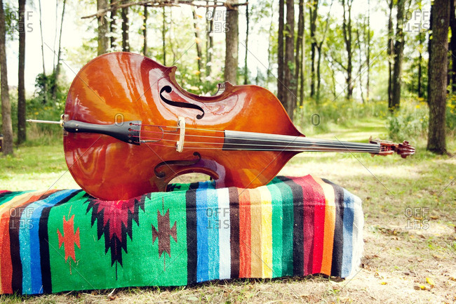 Cello on a colorful woven fabric