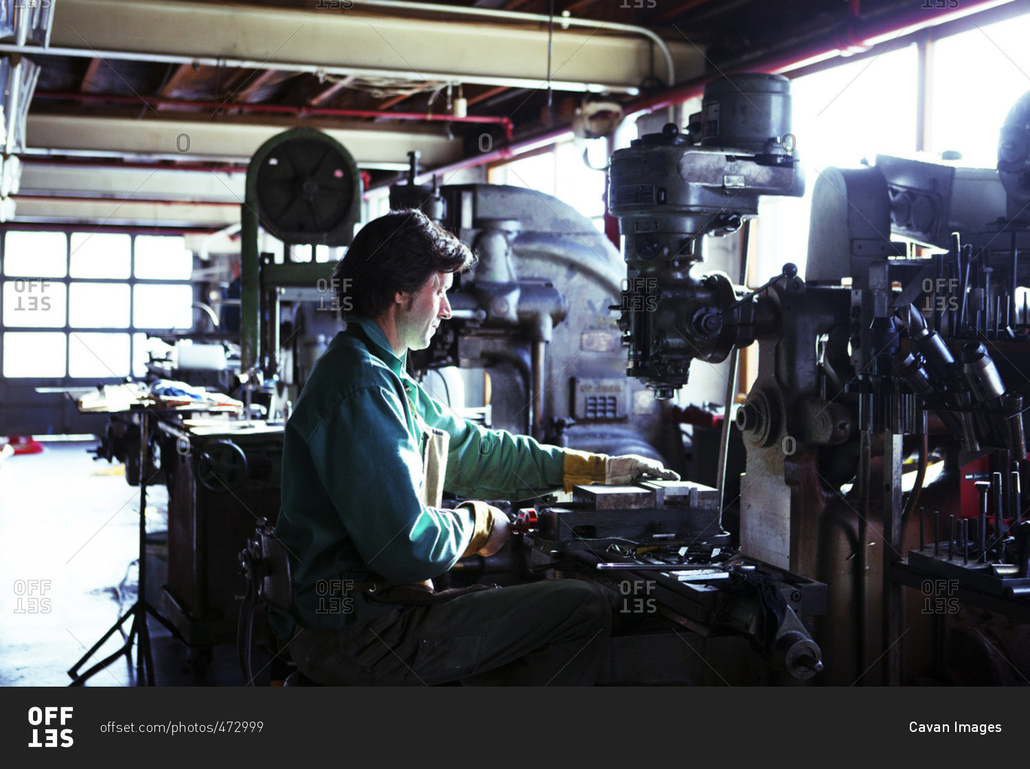 Man using machinery in workshop