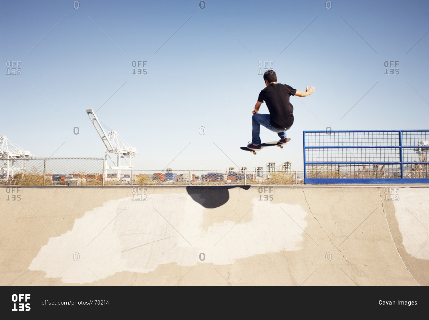 Low angle view of man performing stunt in skateboard park