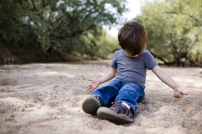 little boy playing outside