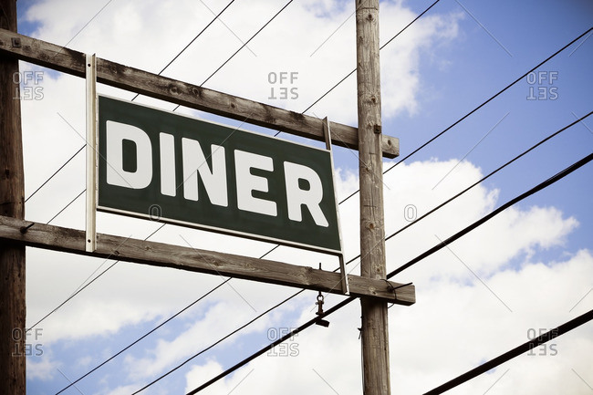 A diner sign against the sky