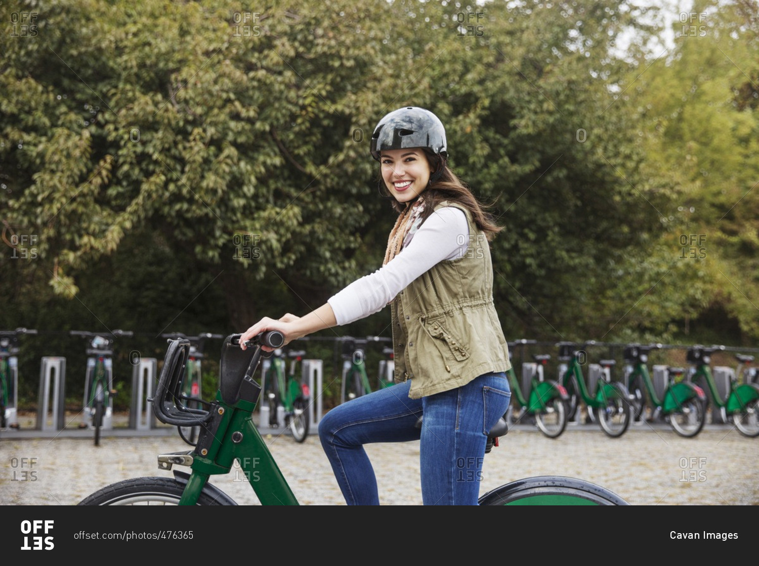 Portrait of smiling woman riding bicycle