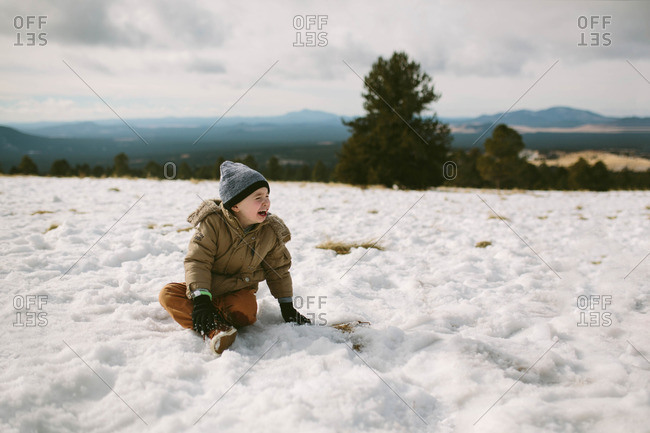 Boy crying in winter setting