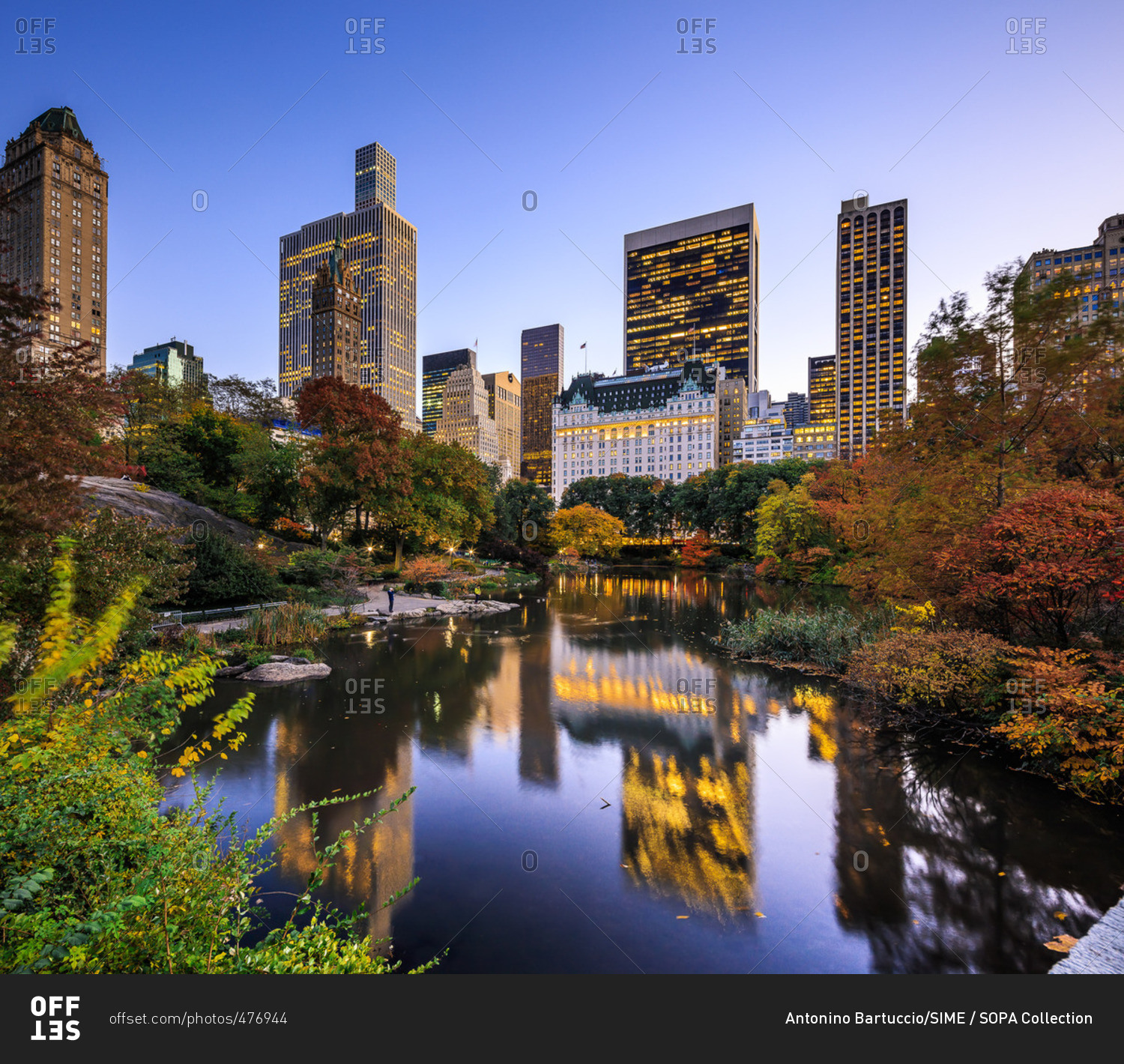 Central Park, The Pond and Plaza Hotel in background during the foliage ...