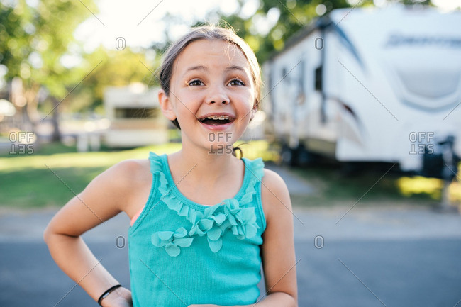 A girl smiling in a campground