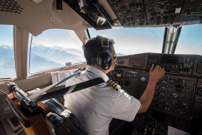 Nepal - April 25, 2016: Pilot in the cockpit of a plane