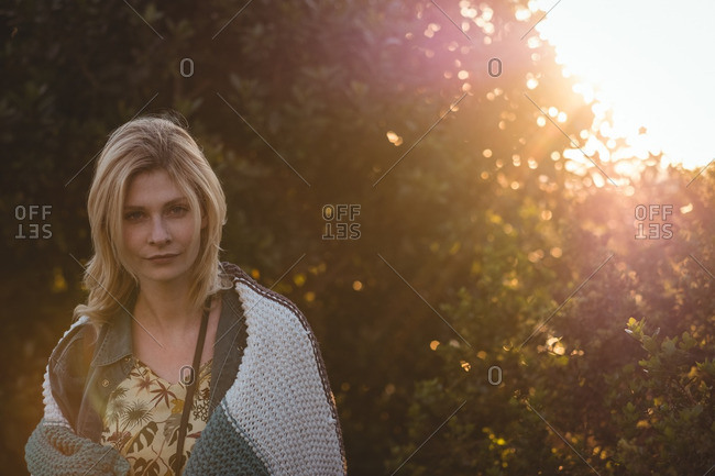 Portrait of beautiful woman wrapped in woolen blanket